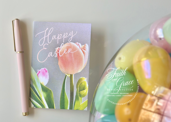 Happy Easter tulips card featured next to a pink pen and a glass bowl of easter eggs.
