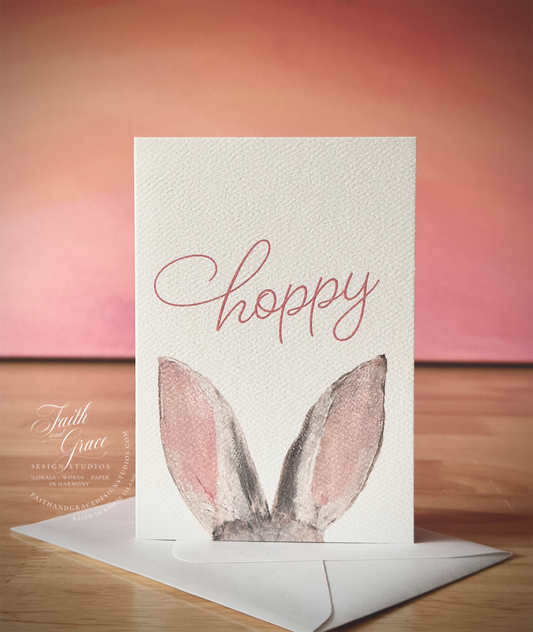 Easter Bunny Ester Card featuring Hoppy and two bunny ears on the front
