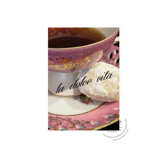 Vintage tea cup and saucer, and Italian butterball cookie featuring la dolce vita in script